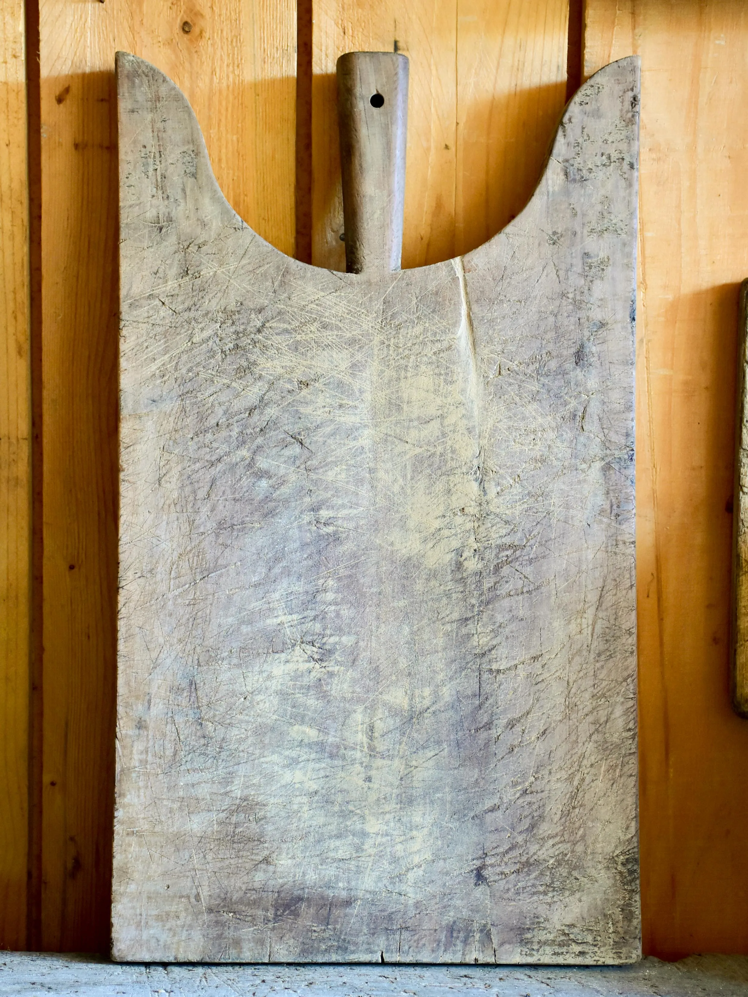 Antique French cutting board with peaked shoulders